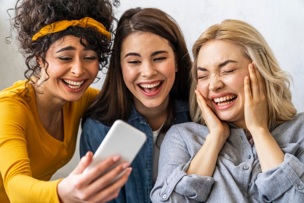  Social Squad App Group of friends laughing and holding phones 