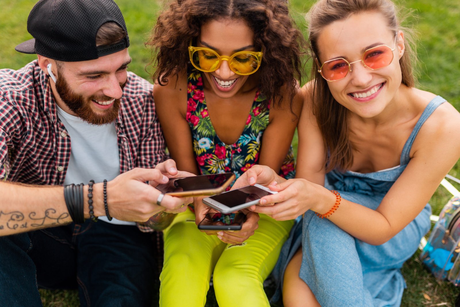 Group of teenagers having fun exchanging clothes and accessories through the Upswap app.