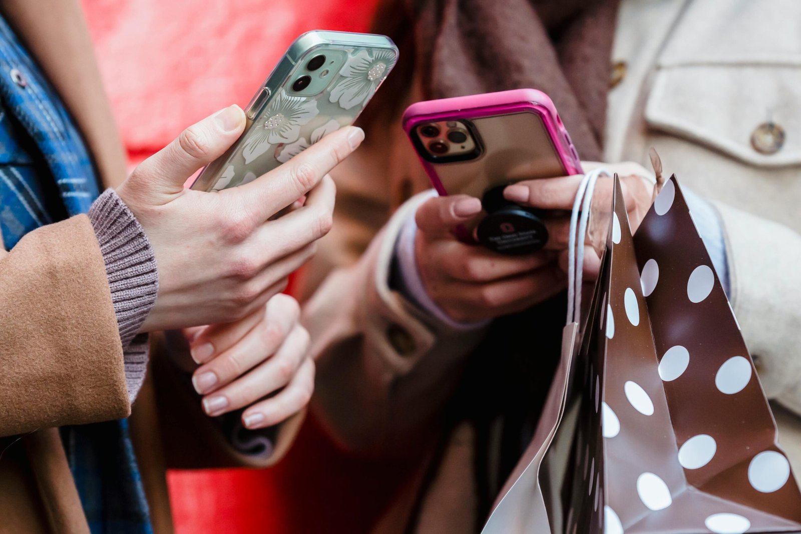 Group of friends using Upswap app on their phones while shopping together.